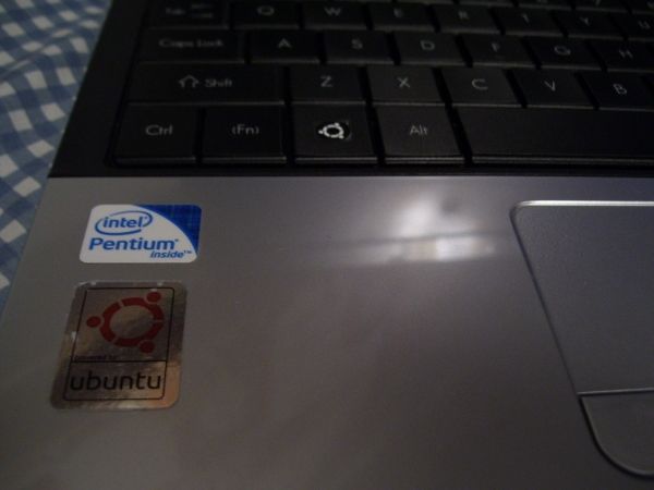 Four "powered by ubuntu" stickers and four keyboard stickers, free from System76!