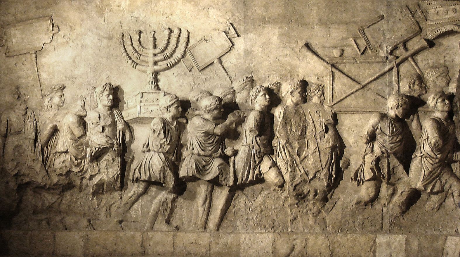 A fresco in the Arch of Titus depicting Roman soldiers returning with looted artifacts from the Temple in Jerusalem