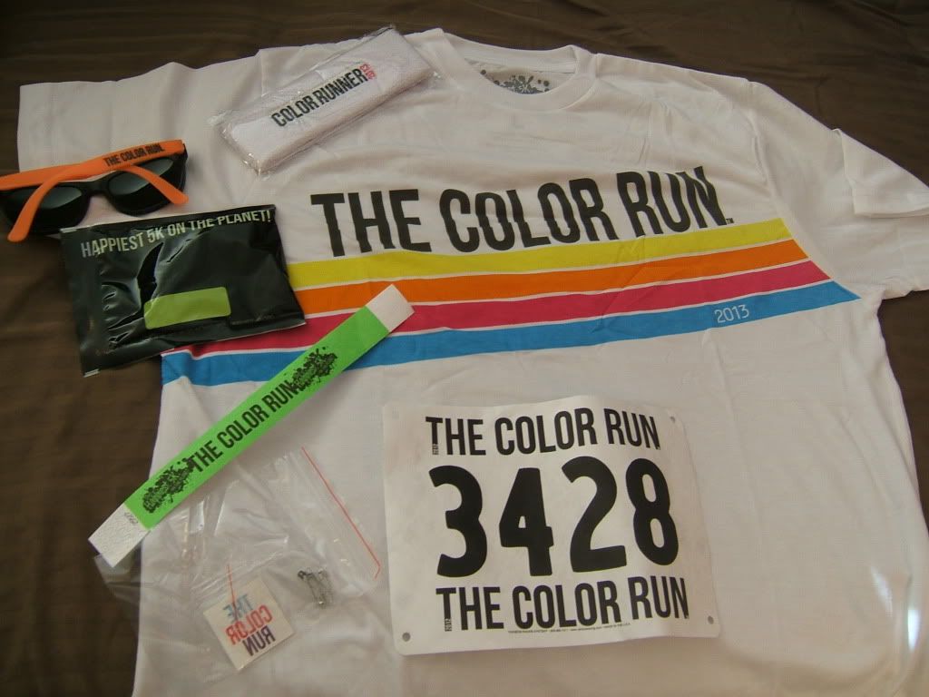 The loot, T-shirt & bib #, sweatband, glasses, packet of color, wrist band and temp tattoos.